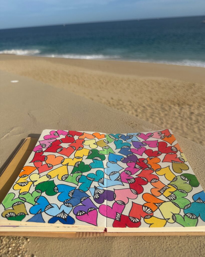 sketchbook layout with colorful heart drawing