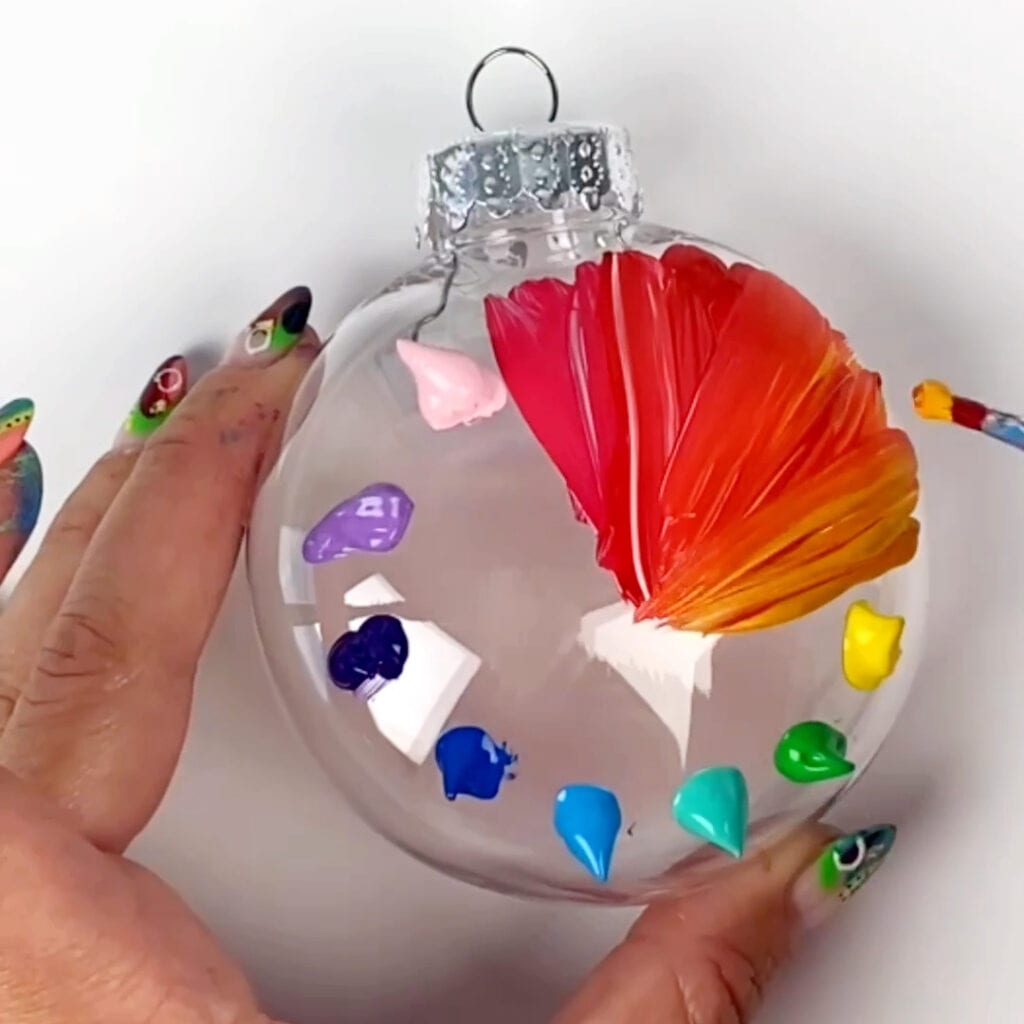 Spreading out the orange and red paint