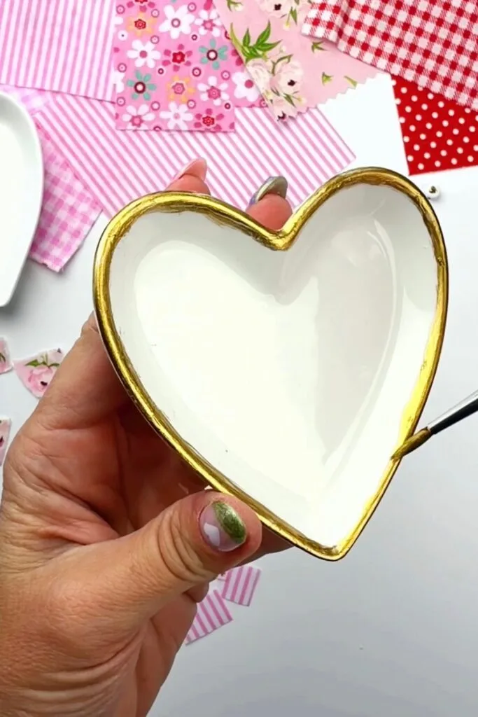 painting the trinket dish rim with gold paint